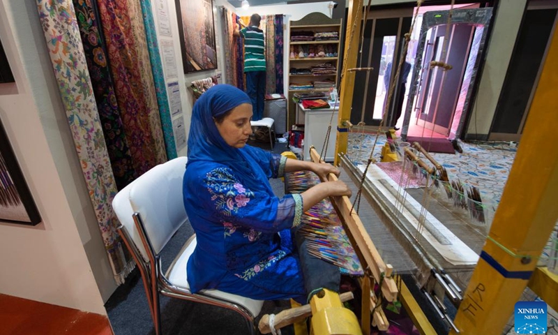 An Indian artisan weaves a Kani shawl at an exhibition titled Incredible India in New Delhi, India, July 22, 2024. The exhibition is set up to highlight India's rich cultural heritage, age-old civilization, geographical diversity, and tourism destinations. (Photo: Xinhua)