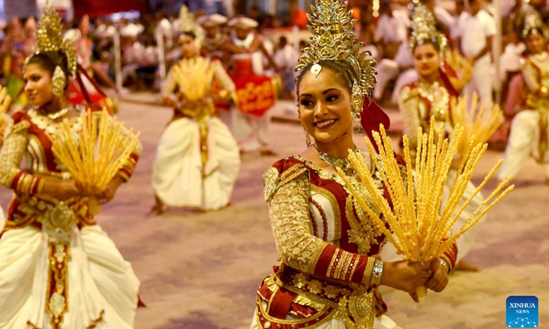 People perform traditional dances during the final day of Kataragama Perahera in Katharagama, Sri Lanka, July 21, 2024. Kataragama Perahera is an important festival in Sri Lanka. During the festival, participants stage fire-walking performances to show their devotion to Kataragama. This year the festival took place from July 7 to 21. (Photo: Xinhua)