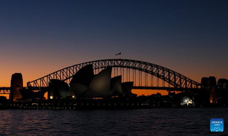 This photo taken on July 23, 2024 shows a sunset view of the Opera House and the Harbor Bridge in Sydney, Australia. (Photo: Xinhua)