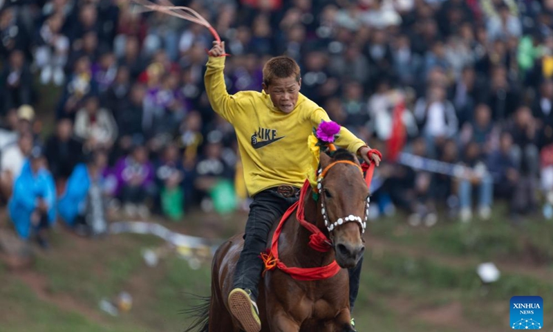 A boy participates in a horse racing during a torch festival in Eliping Township, Butuo County, southwest China's Sichuan Province, July 21, 2024. From July 21 to 23, a traditional torch festival of Yi ethnic group was held in Butuo County. People participated in various folk sports events such as horse racing, sheepfighting, bullfighting and wrestling during the festival. (Photo: Xinhua)