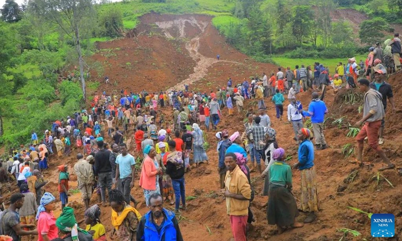 People are seen at the site of a landslide in southern Ethiopia's Geze Gofa district, July 22, 2024. The death toll from a landslide in southern Ethiopia has risen to 146, local government officials said on Tuesday. The deadly landslide occurred on Monday morning at around 10:00 a.m. local time (0700 GMT) in southern Ethiopia's Geze Gofa district. (Photo: Xinhua)