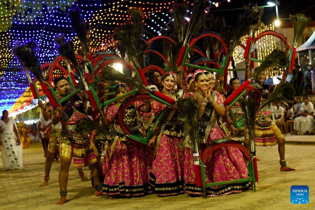 People perform traditional dances during the final day of Kataragama Perahera in Katharagama, Sri Lanka, July 21, 2024. Kataragama Perahera is an important festival in Sri Lanka. During the festival, participants stage fire-walking performances to show their devotion to Kataragama. This year the festival took place from July 7 to 21. (Photo: Xinhua)