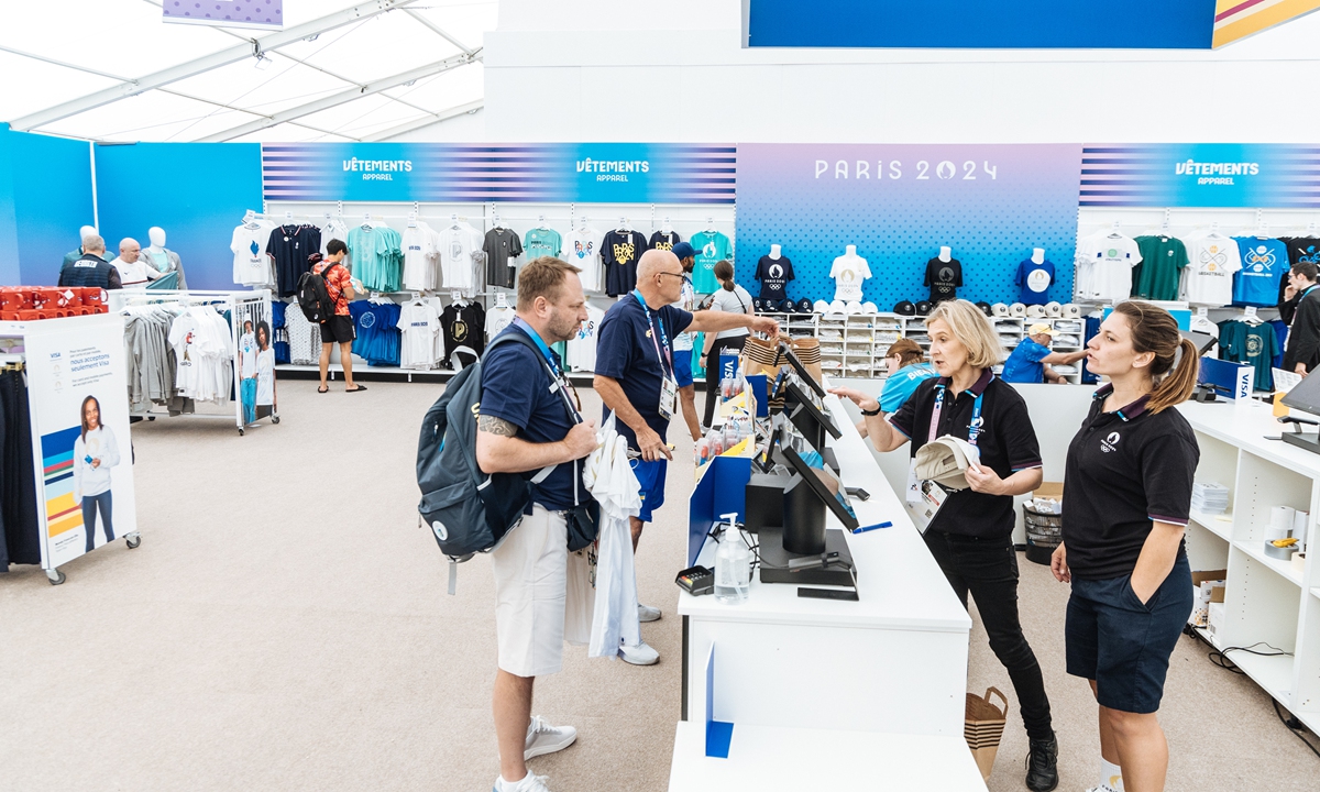 People buy souvenirs at a shop in the Olympic Village in Paris, France, on July 24, 2024. Photo: Li Hao/GT