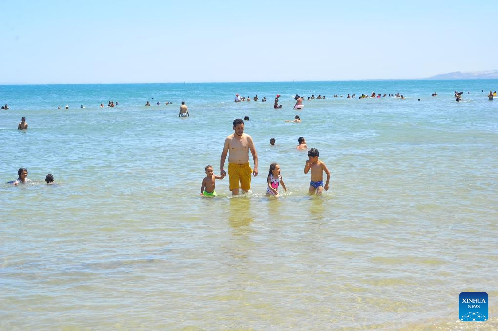 People play in water during a heat wave in Tunis, Tunisia, July 22, 2024. (Photo: Xinhua)