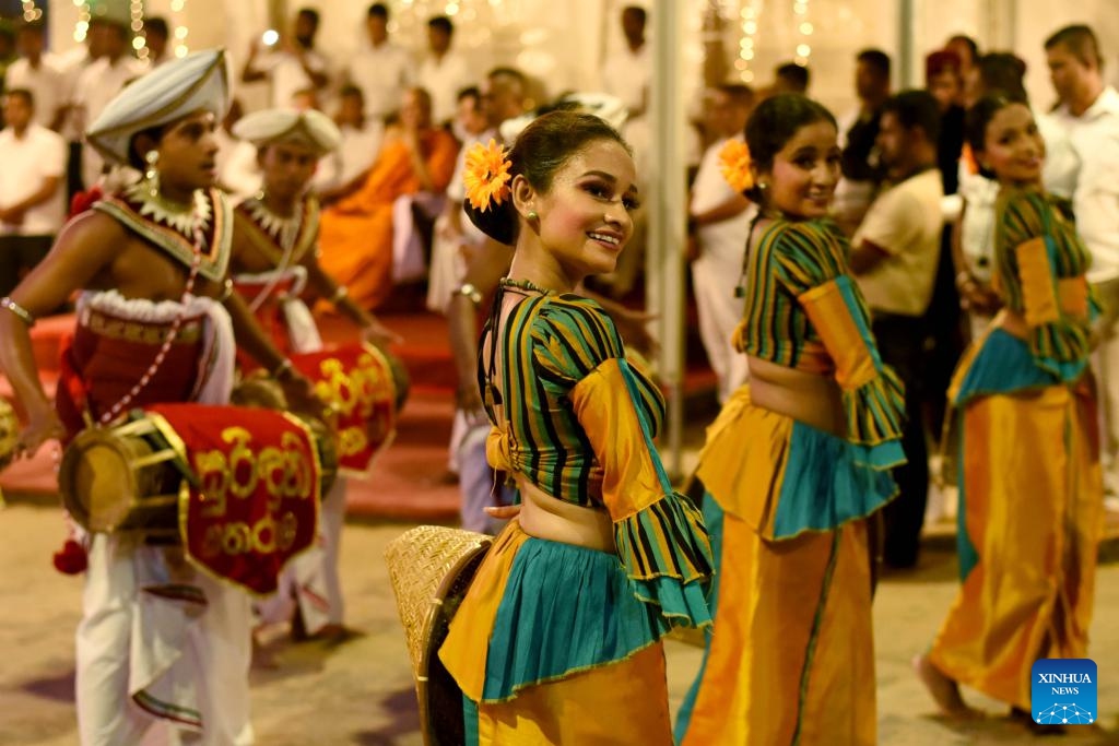 People perform traditional dances during the final day of Kataragama Perahera in Katharagama, Sri Lanka, July 21, 2024. Kataragama Perahera is an important festival in Sri Lanka. During the festival, participants stage fire-walking performances to show their devotion to Kataragama. This year the festival took place from July 7 to 21. (Photo: Xinhua)