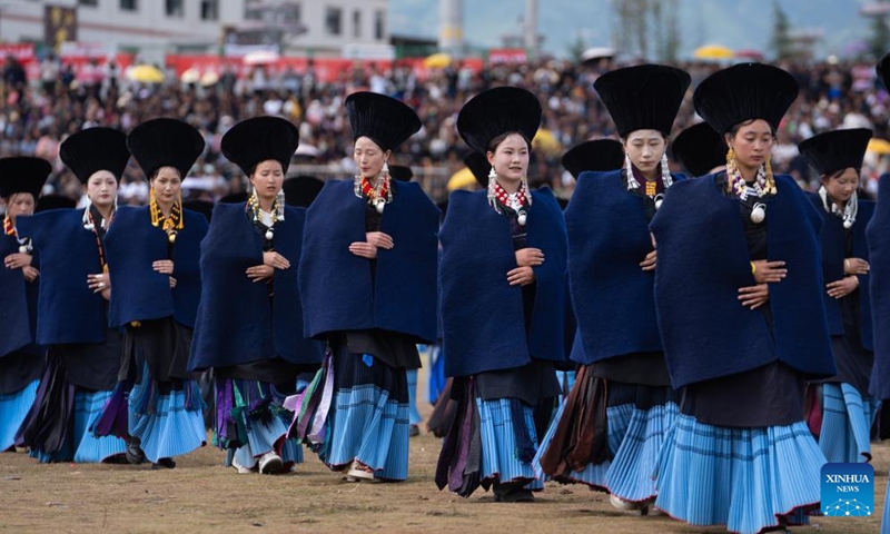 Local people dressed in traditional Yi costumes participate in the opening ceremony of the torch festival in Butuo County of Liangshan Yi Autonomous Prefecture, southwest China's Sichuan Province, July 22, 2024. Residents in traditional costumes of Yi ethnic group participated in the four-day torch festival staged from July 21 to 24. (Photo: Xinhua)