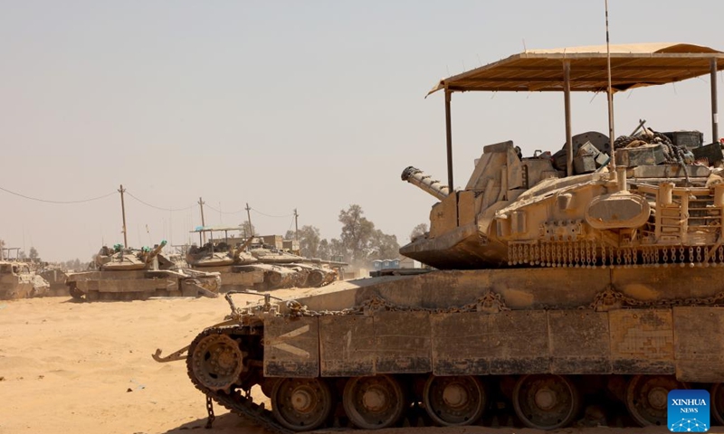 Israeli troops are seen near the border with Gaza Strip, in southern Israel, on July 24, 2024. Palestine on Wednesday urged the U.S. administration and Congress to pressure Israeli Prime Minister Benjamin Netanyahu to stop the ongoing conflict in the Gaza Strip, reported the Palestinian official news agency WAFA. (Photo: Xinhua)