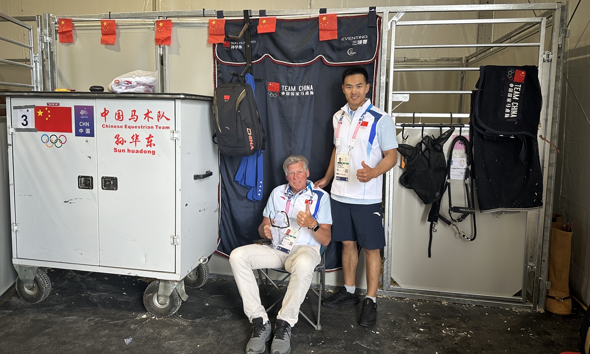 Sun Huadong (right) with coach Martin Lips Photo: Courtesy of the International Federation for Equestrian Sports