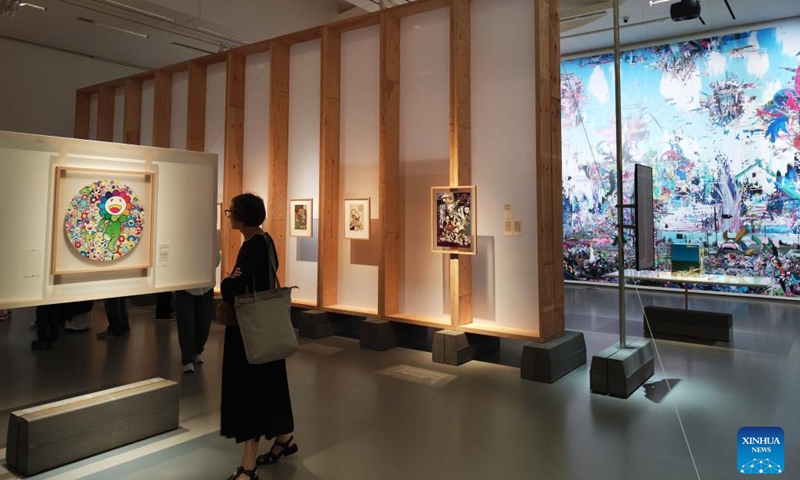 A visitor views an artwork during an exhibition on the Japanese pop culture tradition at National Gallery of Art in Vilnius, Lithuania, on July 24, 2024. Titled Beauties, Ghosts, and Samurai--The Japanese Pop Culture Tradition from Edo Ukiyo-e to Manga, Anime, and Supa Furatto in the 20th and 21st Centuries, the exhibition is held here from July 19 to Oct. 13, presenting works of more than 70 artists. (Photo: Xinhua)