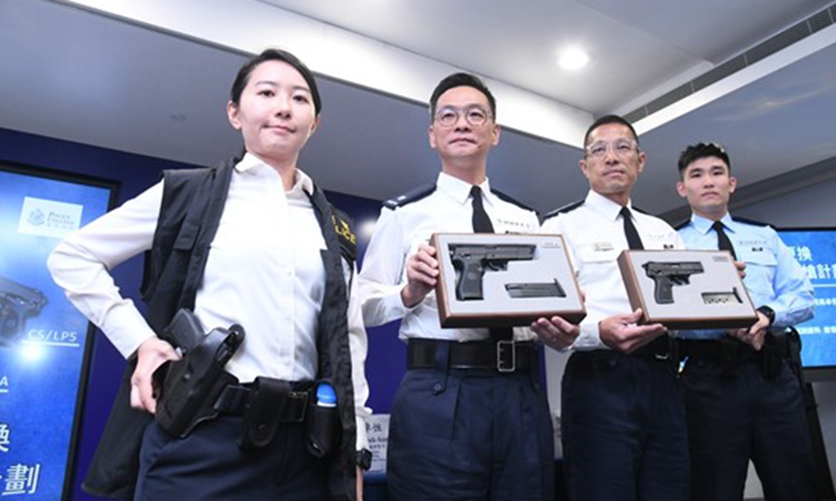 Hong Kong Police Force unveils the plan to replace current US-made pistols with two models of Chinese-made pistols. Photo: Sing Tao Daily 