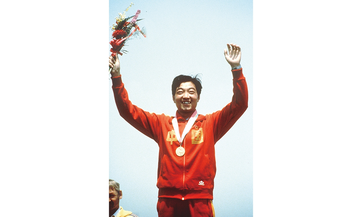 China's first Olympic gold medalist Xu Haifeng poses with his gold medal after winning the men's pistol event final during the Olympic Games in Los Angeles, the US, on July 29, 1984. Photo: VCG