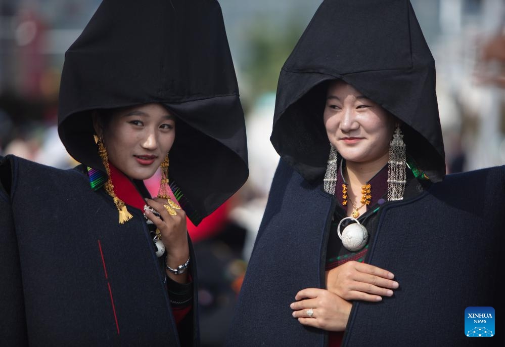 Local people dressed in traditional Yi costumes are seen in Butuo County of Liangshan Yi Autonomous Prefecture, southwest China's Sichuan Province, July 22, 2024. Residents in traditional costumes of Yi ethnic group participated in the four-day torch festival staged from July 21 to 24 (Photo: Xinhua)