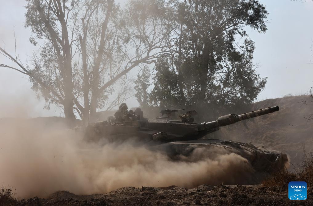 An Israeli tank is seen near the border with Gaza Strip, in southern Israel, on July 24, 2024. Palestine on Wednesday urged the U.S. administration and Congress to pressure Israeli Prime Minister Benjamin Netanyahu to stop the ongoing conflict in the Gaza Strip, reported the Palestinian official news agency WAFA. (Photo: Xinhua)