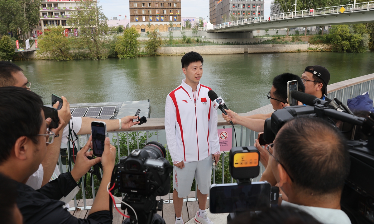 China's legendary table tennis player Ma Long speaks to the media at the Olympic Village, Paris on July 25, 2024. Ma, who has claimed three team golds and two singles titles in previous Olympic Games, will carry China's flag at the 2024 Paris Olympic Games opening ceremony on Friday evening local time, along with artistic swimmer Feng Yu. Photo: cnsphoto