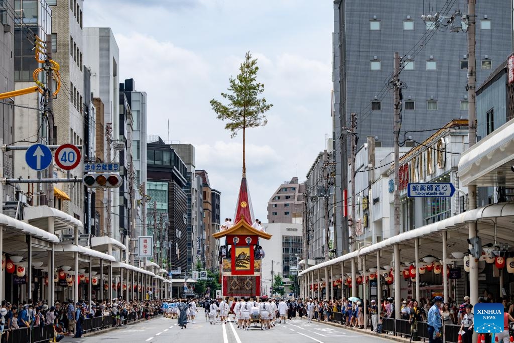 People watch a decorated float during the Gion Festival in Kyoto, Japan, on July 24, 2024. The Gion Festival, which lasts throughout the entire month of July, is an annual traditional festival in Kyoto. It originated in 869 when a plague broke out in Kyoto. To pray for peace and the elimination of the disease, a grand festival was held. This festival gradually evolved into an annual fixed event and has continued to this day. (Photo: Xinhua)