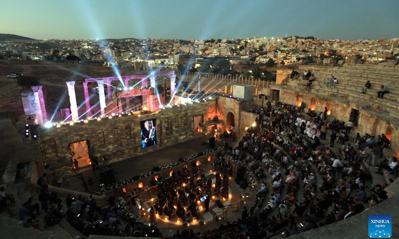 People watch a performance at a theater of Jerash archaeological site during the 38th Jerash Festival for Culture and Arts in Jerash, Jordan, July 24, 2024. This event kicked off on Wednesday in the ancient historic city of Jerash, some 50 km to the north of Amman. (Photo: Xinhua)