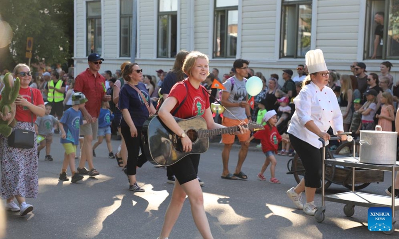 People from different walks of life take part in the Maritime Festival parade in Kotka, Finland, July 24, 2024. The four-day festival kicked off here on Wednesday. (Photo: Xinhua)