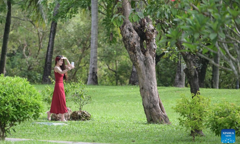 A tourist visits Bailu park in Sanya, south China's Hainan Province, July 22, 2024. Sanya, a popular tourist spot in the southern island province of Hainan, boasts excellent natural beauty. (Photo: Xinhua)