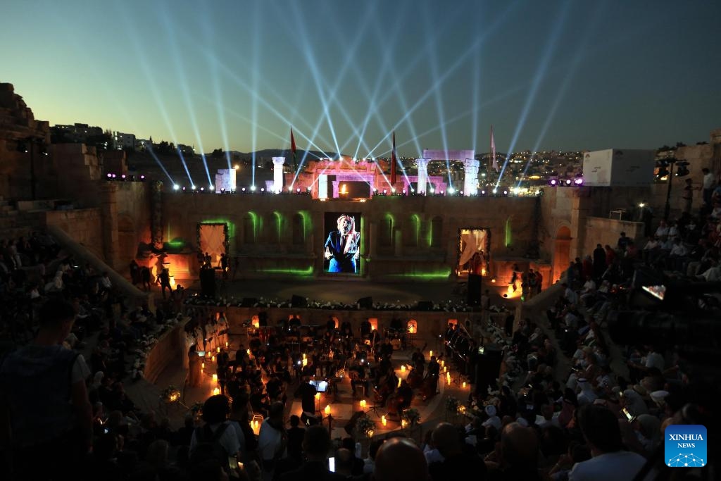 People watch a performance at a theater of Jerash archaeological site during the 38th Jerash Festival for Culture and Arts in Jerash, Jordan, July 24, 2024. This event kicked off on Wednesday in the ancient historic city of Jerash, some 50 km to the north of Amman. (Photo: Xinhua)