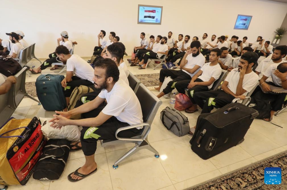 Migrants wait at the Deportation Office of the Libyan Illegal Immigration Control Department in Tripoli, Libya, on July 25, 2024. The Illegal Migration Control Department of Libya on Thursday deported more than 700 illegal migrants to their home countries of Niger and Egypt, an official told Xinhua. (Photo: Xinhua)