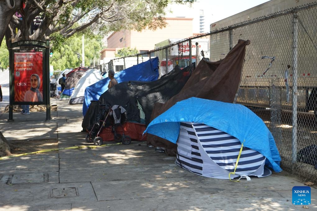 Tents of homeless people are seen in downtown Los Angeles, California, the United States, on July 25, 2024. California governor Gavin Newsom issued an executive order on Thursday directing officials in the most populated U.S. state to urgently address homeless encampments. (Photo: Xinhua)