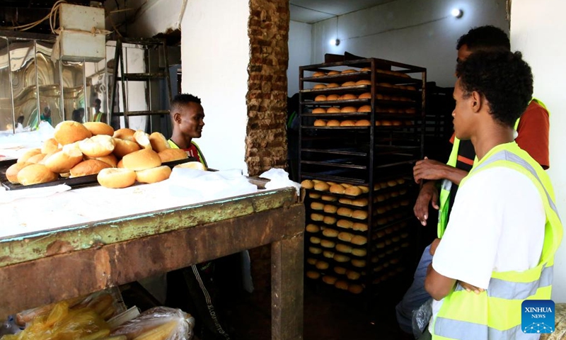 Staff members bake bread at a charity bakery in Omdurman city, Sudan, July 24, 2024. The Charity Bread Project has recently been launched by the Human Appeal, a non-profit organization, to distribute free bread for people in need in Omdurman city. (Photo: Xinhua)