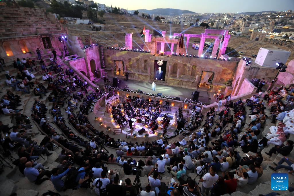 People watch a performance at a theater of Jerash archaeological site during the 38th Jerash Festival for Culture and Arts in Jerash, Jordan, July 24, 2024. This event kicked off on Wednesday in the ancient historic city of Jerash, some 50 km to the north of Amman. (Photo: Xinhua)