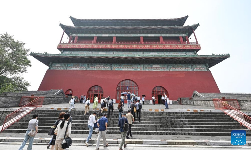 Visitors are pictured in front of the Drum Tower in Beijing, capital of China, July 16, 2024. Photo: Xinhua