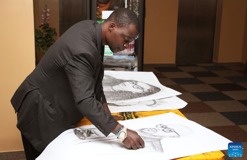 An artist sketches at the creators' market as part of the Biennale Ouidah 2024 in Cotonou, Benin, July 26, 2024. Photo: Xinhua