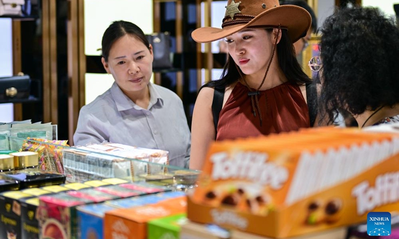 Tourists visit a duty-free shop at the Horgos International Border Cooperation Center on the China-Kazakhstan border in Horgos, northwest China's Xinjiang Uygur Autonomous Region, July 26, 2024. Since the implementation of mutual visa exemption between Kazakhstan and China in November 2023, Horgos Port has witnessed a substantial increase of entry and exit tourist trips. In recent days, the Horgos International Border Cooperation Center on the China-Kazakhstan border has ushered in the peak of border tourism. Photo: Xinhua