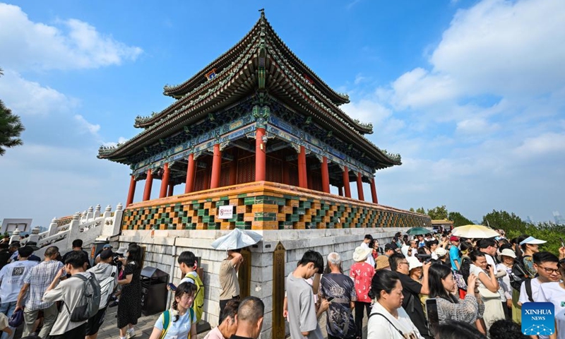 People visit the Wanchun pavilion on the mountain top of the Jingshan park in Beijing, capital of China, July 16, 2024. Photo: Xinhua