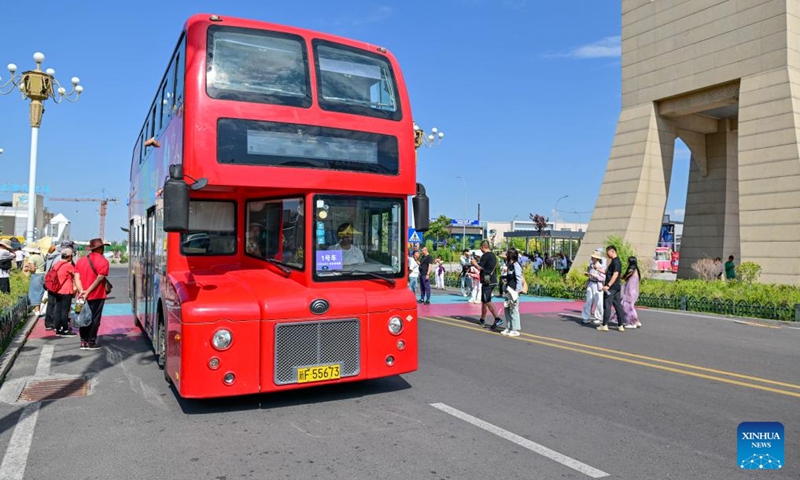 A tourism bus is pictured at the Horgos International Border Cooperation Center on the China-Kazakhstan border in Horgos, northwest China's Xinjiang Uygur Autonomous Region, July 26, 2024. Since the implementation of mutual visa exemption between Kazakhstan and China in November 2023, Horgos Port has witnessed a substantial increase of entry and exit tourist trips. In recent days, the Horgos International Border Cooperation Center on the China-Kazakhstan border has ushered in the peak of border tourism. Photo: Xinhua