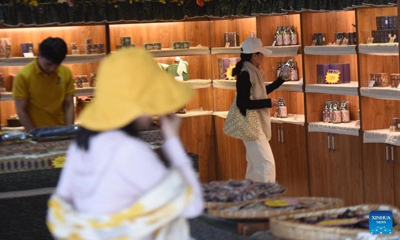 Tourists select lavender products at a lavender farm in Huocheng County, northwest China's Xinjiang Uygur Autonomous Region, July 26, 2024. Lavender was introduced in Huocheng County more than half century ago from France. Sharing many similarities with Provence in France as latitude, meteorological and soil conditions, Huocheng become the largest lavender production base in China and the third largest in the world, following Provence and Japan's Furano. Photo: Xinhua