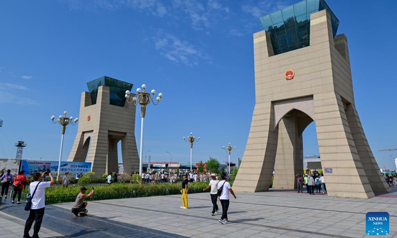 Tourists take photos at the Horgos International Border Cooperation Center on the China-Kazakhstan border in Horgos, northwest China's Xinjiang Uygur Autonomous Region, July 26, 2024. Since the implementation of mutual visa exemption between Kazakhstan and China in November 2023, Horgos Port has witnessed a substantial increase of entry and exit tourist trips. In recent days, the Horgos International Border Cooperation Center on the China-Kazakhstan border has ushered in the peak of border tourism. Photo: Xinhua