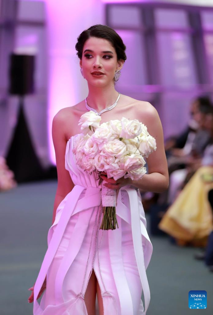 A model presents a bridal creation at the Designer Wedding Show 2024 at Lotus Tower in Colombo, Sri Lanka, on July 28, 2024. Photo: Xinhua