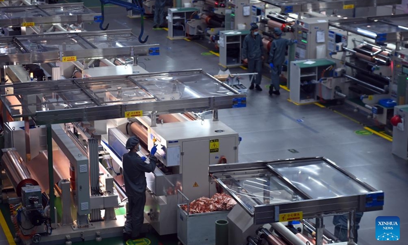 Workers work on a copper foil production line in Lanzhou New Area in Lanzhou, northwest China's Gansu Province, July 25, 2024. In recent years, Lanzhou New Area has introduced 1,080 high-quality industrial projects with a total investment of 528 billion yuan (about $72.8 billion), and the annual increasing rate of industrial added value has maintained over 50 percent. From 2011 to 2023, the regional GDP of Lanzhou New Area has increased from less than 500 million yuan (about $69 million) to 37.5 billion yuan (about $5.2 billion). Photo: Xinhua