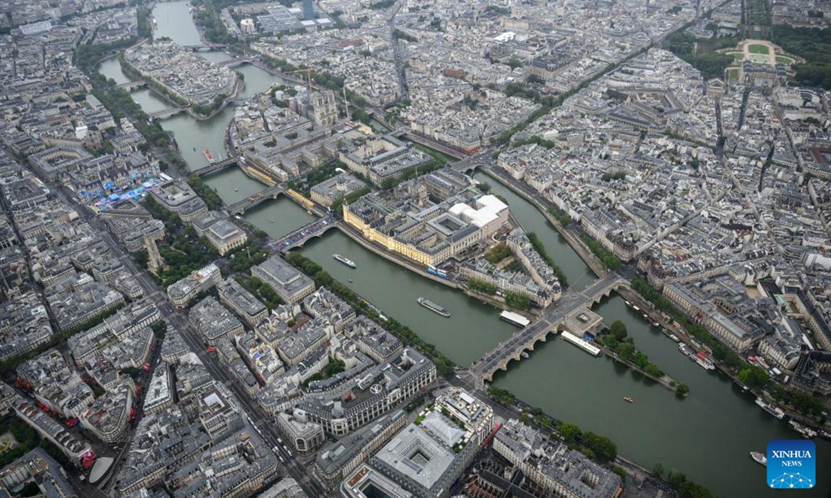 This photo taken from an helicopter on July 26, 2024 shows an aerial view of the delegation boats navigating down the Seine river past Ile de la Cite during the opening ceremony of the Paris 2024 Olympic Games in Paris, France. Photo: Xinhua