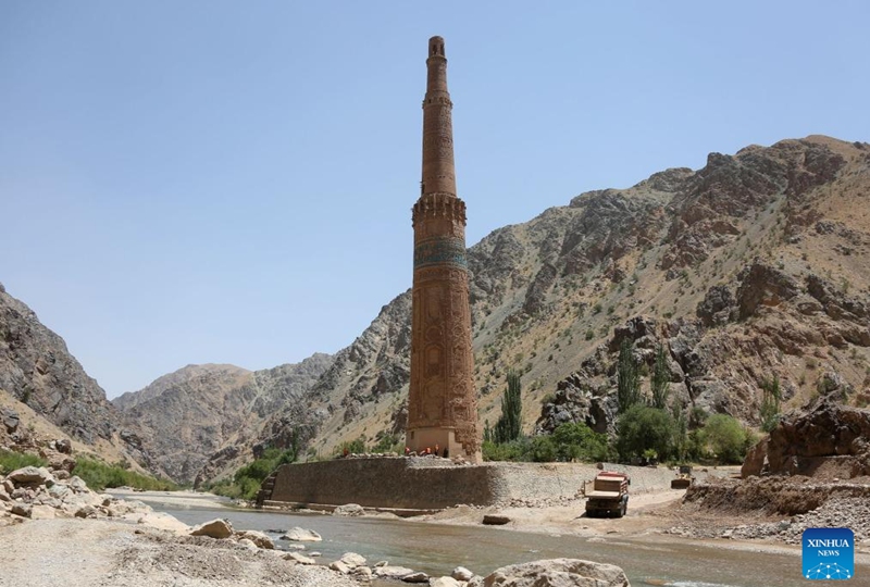 This photo taken on July 28, 2024 shows the Minaret of Jam and the Hari River in the Shahrak District, central Afghanistan's Ghor Province. The Minaret of Jam, along with its archaeological remains, was inscribed on the World Heritage List by the United Nations Educational, Scientific and Cultural Organization (UNESCO) in 2002. In May, a huge flood hit the province, posing a threat to the minaret, which stands near the Hari River. Photo: Xinhua