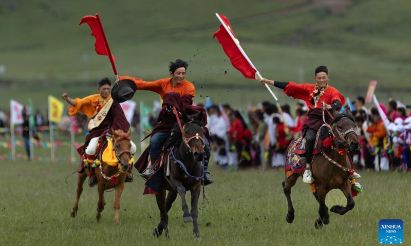 Locals participate in a horsemanship performance on a grassland in Baiyu County, Garze Tibetan Autonomous Prefecture, southwest China's Sichuan Province, July 27, 2024. A rural folk event kicked off here on Saturday, consisting of performances, milking competition, yak beauty contest, horse racing and other activities. Photo: Xinhua