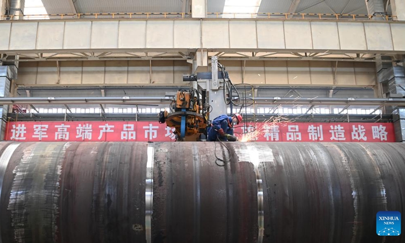 A worker welds in a workshop of LS Group High Tech Equipment Industrial Park of Lanzhou New Area in Lanzhou, northwest China's Gansu Province, July 25, 2024. In recent years, Lanzhou New Area has introduced 1,080 high-quality industrial projects with a total investment of 528 billion yuan (about $72.8 billion), and the annual increasing rate of industrial added value has maintained over 50 percent. From 2011 to 2023, the regional GDP of Lanzhou New Area has increased from less than 500 million yuan (about $69 million) to 37.5 billion yuan (about $5.2 billion). Photo: Xinhua