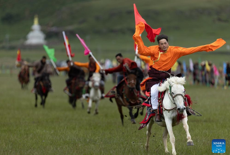 Locals participate in a horsemanship performance on a grassland in Baiyu County, Garze Tibetan Autonomous Prefecture, southwest China's Sichuan Province, July 27, 2024. A rural folk event kicked off here on Saturday, consisting of performances, milking competition, yak beauty contest, horse racing and other activities. Photo: Xinhua