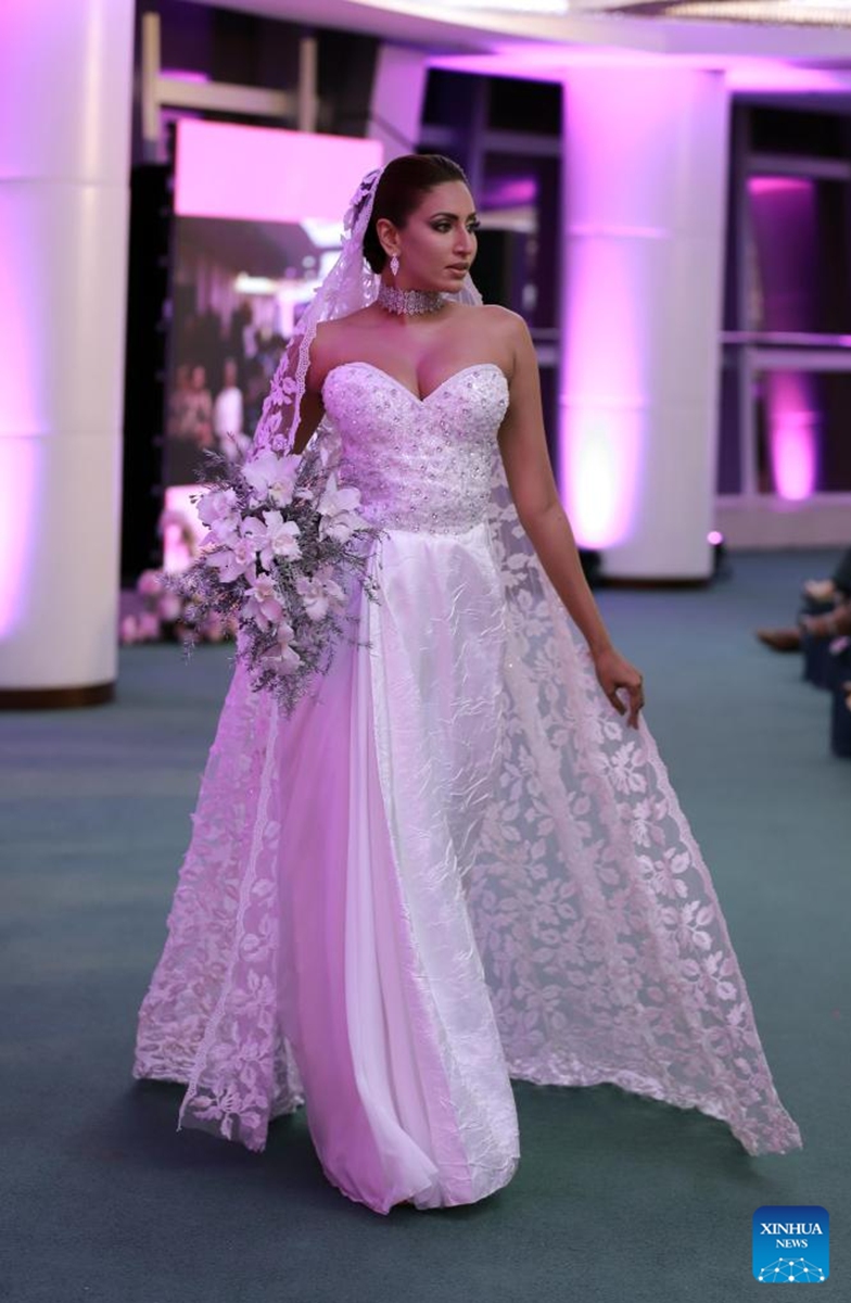 A model presents a bridal creation at the Designer Wedding Show 2024 at Lotus Tower in Colombo, Sri Lanka, on July 28, 2024. Photo: Xinhua