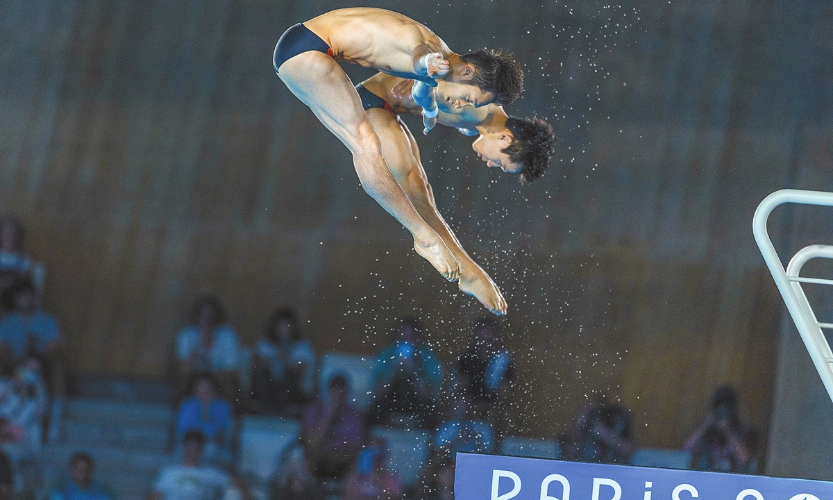 China's diving pair Lian Junjie and Yang Hao win the men's synchronized 10m platform final with 490.35 points, defeating Thomas Daley and Noah Williams of the UK. This is the fourth gold medal for Team China at the Paris 2024 Olympics, on July 29, 2024. Nathan Zsombor-Murray and Rylan Wiens of Canada rounded out the podium with bronze. Photo: Li Hao/GT