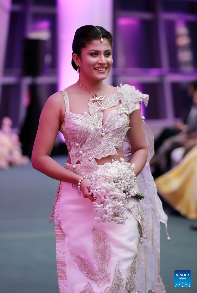 A model presents a bridal creation at the Designer Wedding Show 2024 at Lotus Tower in Colombo, Sri Lanka, on July 28, 2024. Photo: Xinhua