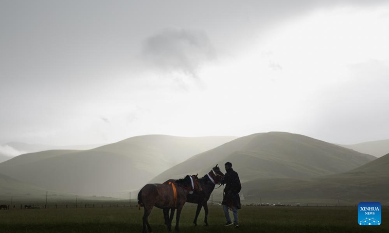 A rider and his horses are pictured before a horse racing in Baiyu County, Garze Tibetan Autonomous Prefecture, southwest China's Sichuan Province, July 27, 2024. Photo: Xinhua