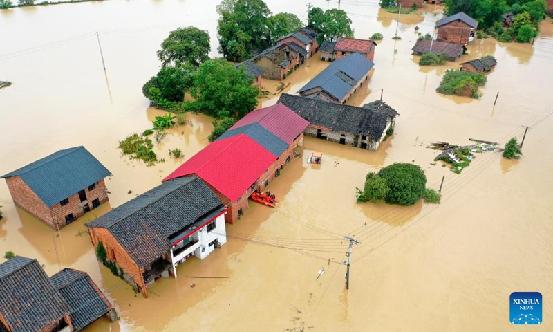 An aerial drone photo taken on July 28, 2024 shows rescuers relocating residents at Jingtang Village of Zixing City, central China's Hunan Province. The residual winds from Typhoon Gaemi continue to bring heavy rains to many places in Hunan Province, and local authorities are actively carrying out rescue and relief work. Photo: Xinhua