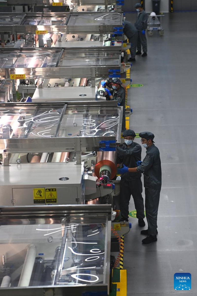 Workers work on a copper foil production line in Lanzhou New Area in Lanzhou, northwest China's Gansu Province, July 25, 2024. In recent years, Lanzhou New Area has introduced 1,080 high-quality industrial projects with a total investment of 528 billion yuan (about $72.8 billion), and the annual increasing rate of industrial added value has maintained over 50 percent. From 2011 to 2023, the regional GDP of Lanzhou New Area has increased from less than 500 million yuan (about $69 million) to 37.5 billion yuan (about $5.2 billion). Photo: Xinhua