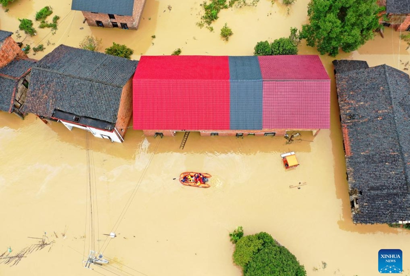 An aerial drone photo taken on July 28, 2024 shows rescuers relocating residents at Jingtang Village of Zixing City, central China's Hunan Province. The residual winds from Typhoon Gaemi continue to bring heavy rains to many places in Hunan Province, and local authorities are actively carrying out rescue and relief work. Photo: Xinhua