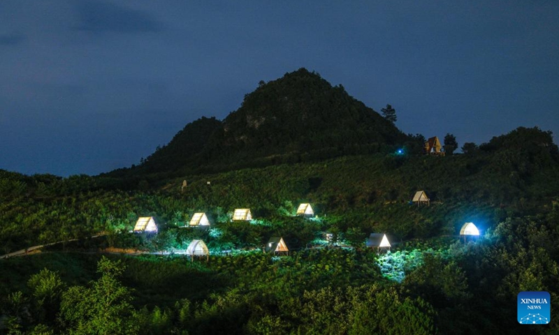 This photo taken on July 26, 2024 shows a camping base at an ecological park in Longli County, southwest China's Guizhou Province. During summer vacation, Longli County has become a popular destination for tourists to escape the sweltering summer heat. In recent years, local authorities have promoted the upgrading of the rural tourism, which attracts more tourists to visit. Photo: Xinhua