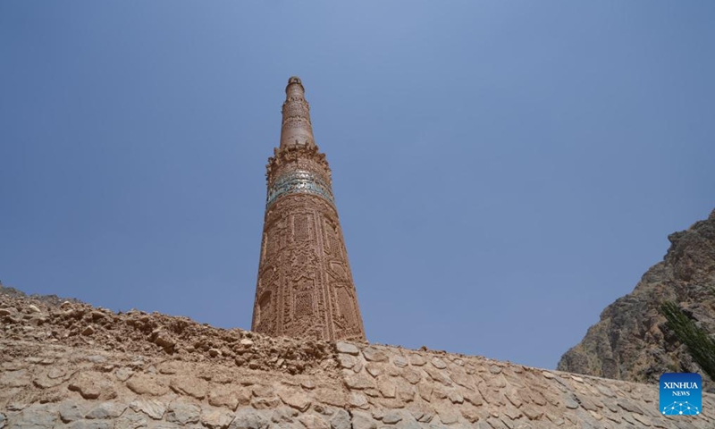 This photo taken on July 28, 2024 shows the repaired protection wall and the Minaret of Jam after a flood in the Shahrak District, central Afghanistan's Ghor Province. The Minaret of Jam, along with its archaeological remains, was inscribed on the World Heritage List by the United Nations Educational, Scientific and Cultural Organization (UNESCO) in 2002. In May, a huge flood hit the province, posing a threat to the minaret, which stands near the Hari River. Photo: Xinhua